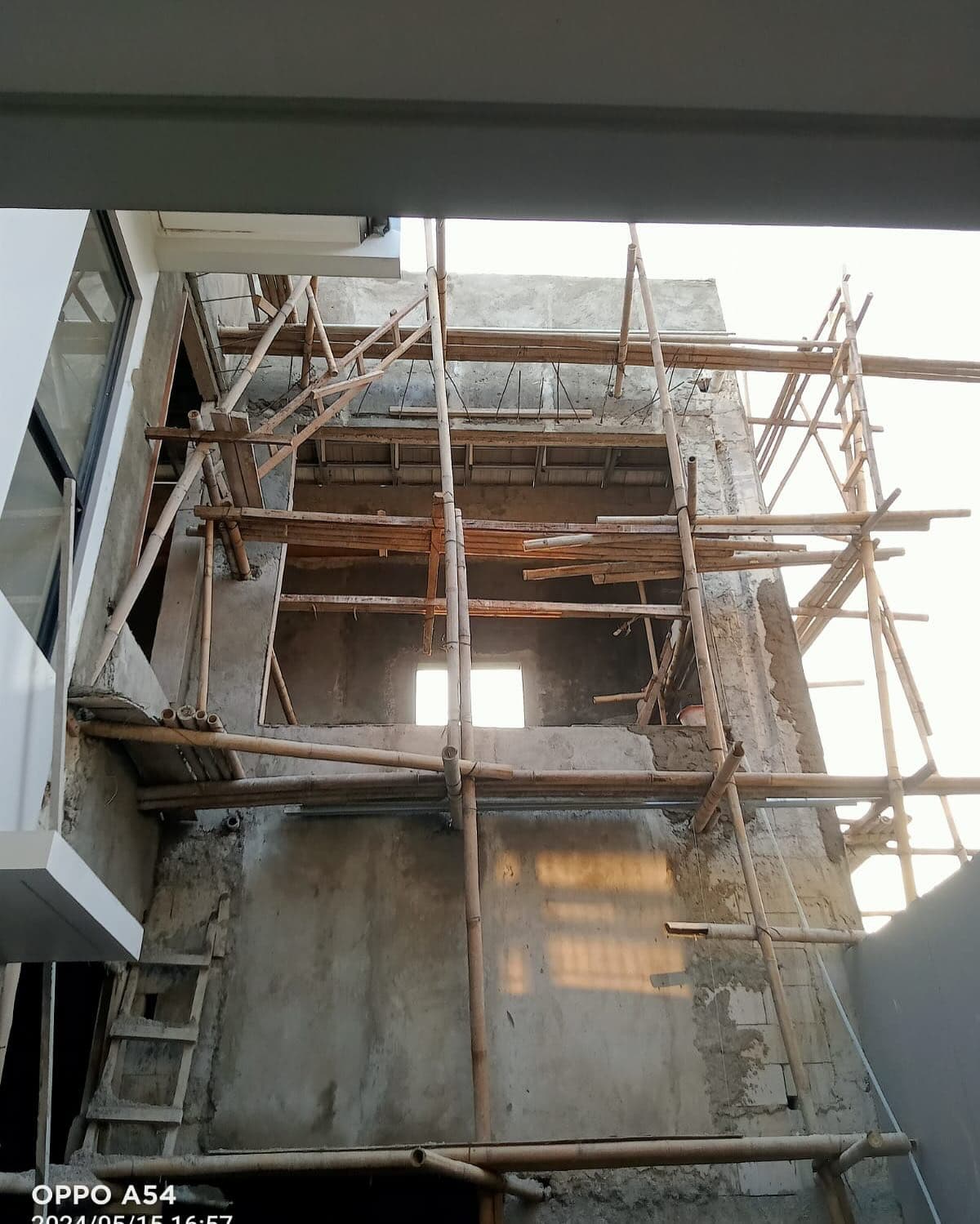 Bamboo scaffolding against the concrete structure