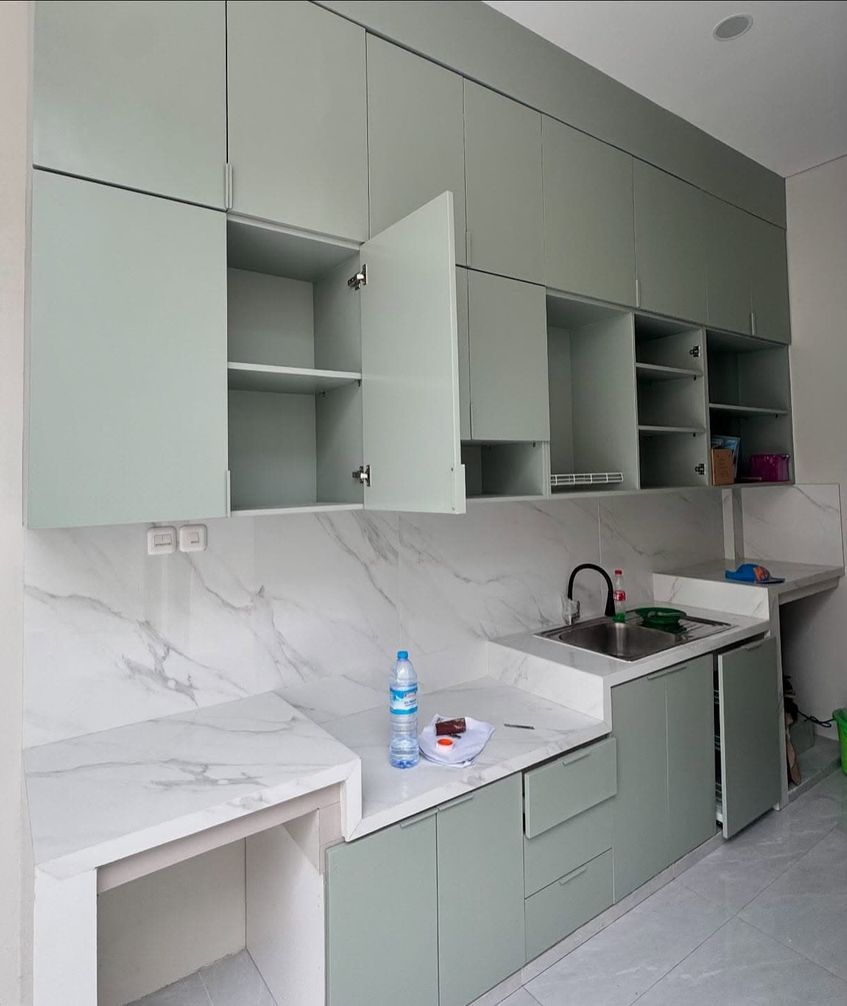 Kitchen cabinets during installation, doors open