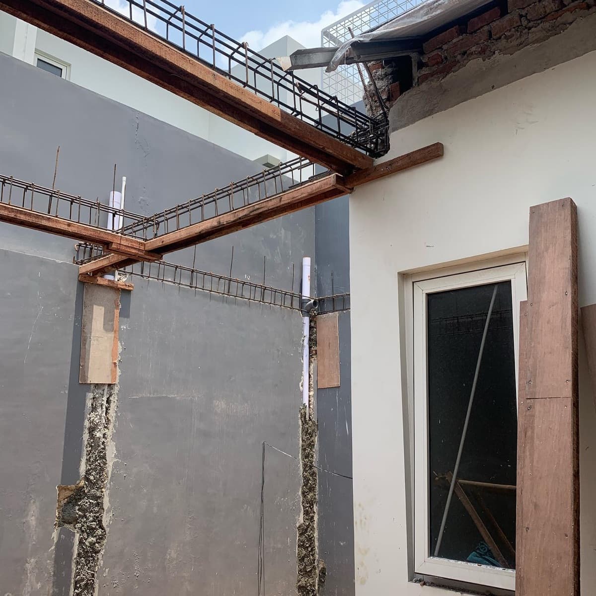 Site photo: structure work with timber beams and blockwork