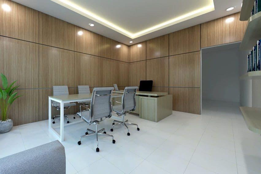 Office workspace render with desks and a lounge seat